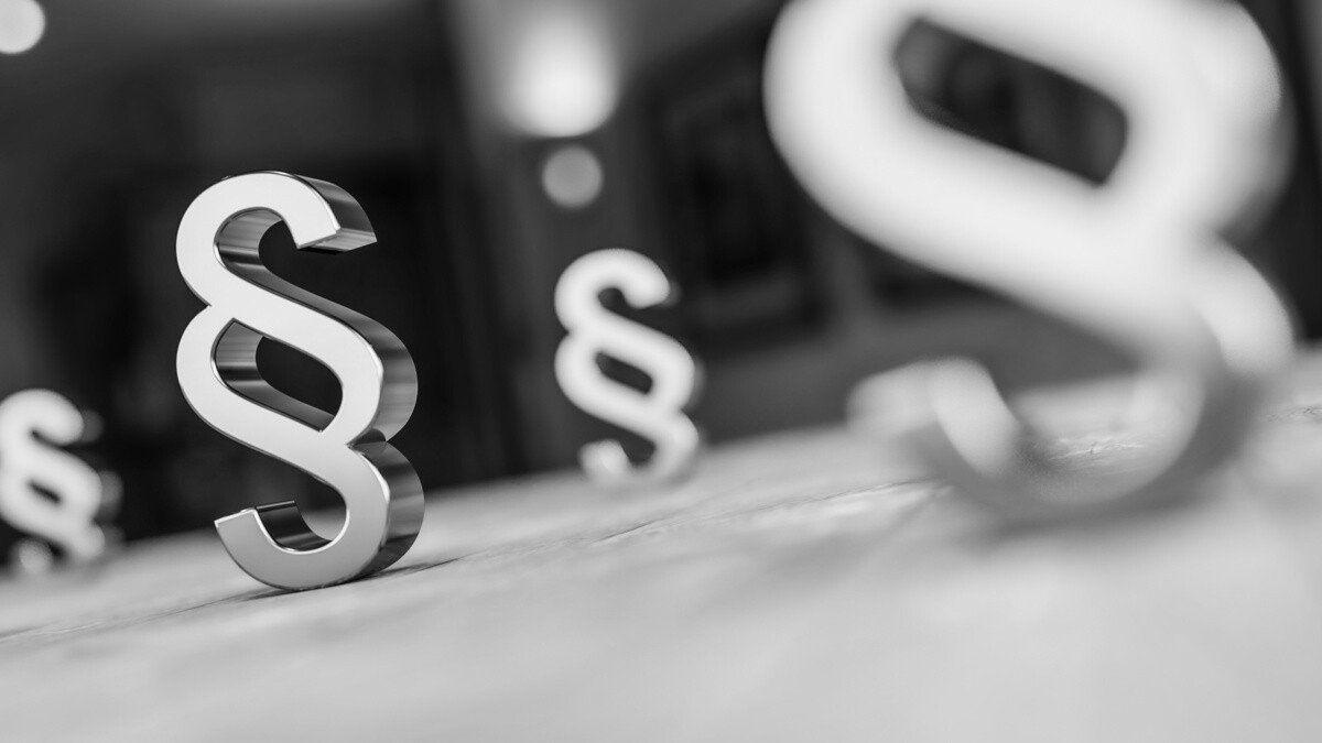 Regulierung Teilverkauf - Paragraphen Icons auf schwarzem Hintergrund